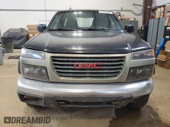 2009 GMC Canyon Work Truck z VIN 1GTDT19E798132510, wystawiony jako Copart lot #57361995 z przebiegiem 240 338 mil mil oraz Czysty tytuł • Clean title. Historia ofert i sprzedaży dostępna na DreamBid. Obrazek 5.