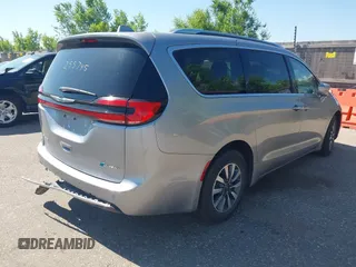 2021 Chrysler Pacifica Hybrid Touring L with VIN 2C4RC1L76MR594571, listed as a IAAI auction lot 40255745 with 58,163 mi miles and . Bid and sale history available at DreamBid. Image 4.