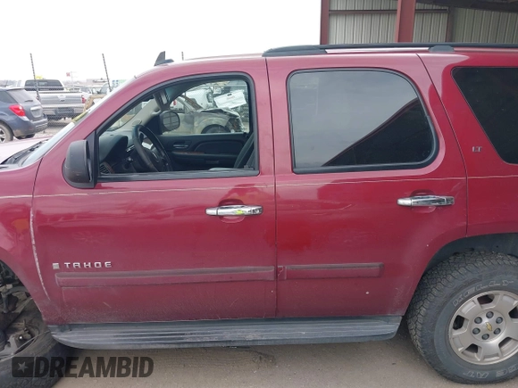 2007 Chevrolet Tahoe LTZ with VIN 1GNFK130X7J313106, listed as a IAAI auction lot 42042891 with 199,763 mi miles and . Bid and sale history available at DreamBid. Image 14.