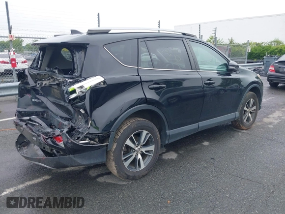 2018 Toyota RAV4 XLE with VIN 2T3WFREVXJW501296, listed as a IAAI auction lot 42358130 with 163,669 mi miles and . Bid and sale history available at DreamBid. Image 4.