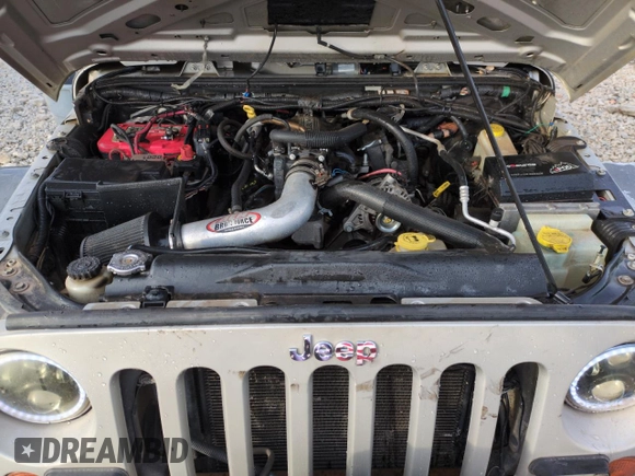 2007 Jeep Wrangler Rubicon z VIN 1J8GA64157L125319, wystawiony jako Copart lot #82929184 z przebiegiem 82 019 mil mil oraz Szkoda całkowita • Salvage title. Historia ofert i sprzedaży dostępna na DreamBid. Obrazek 11.