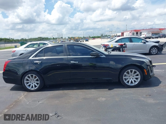 2014 Cadillac CTS RWD with VIN 1G6AP5SX0E0185913, listed as a IAAI auction lot 42685622 with 107,406 mi miles and . Bid and sale history available at DreamBid. Image 13.