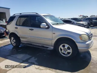 2000 Mercedes-Benz M 320/430/500 with VIN 4JGAB54E7YA151114, listed as a Copart auction lot 50175395 with 166,093 mi miles and Salvage Title. Bid and sale history available at DreamBid. Image 4.