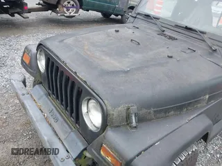 2000 Jeep Wrangler Sport z VIN 1J4FA49S1YP700545, wystawiony jako IAAI lot #42367828 z przebiegiem 214 698 mil mil oraz . Historia ofert i sprzedaży dostępna na DreamBid. Obrazek 6.