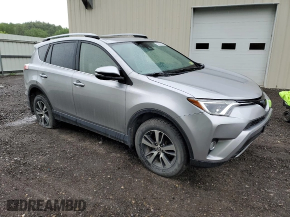 2018 Toyota RAV4 XLE with VIN JTMRFREV2JJ200677, listed as a Copart auction lot 59660535 with 82,283 mi miles and Salvage title. Bid and sale history available at DreamBid. Image 4.