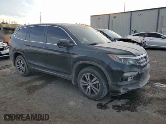 2016 Honda Pilot EX-L with VIN 5FNYF6H72GB106385, listed as a Copart auction lot 44000395 with 128,520 mi miles and Salvage Title. Bid and sale history available at carsss.com. Image 4.