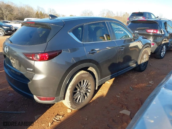2019 Mazda CX-5 Touring with VIN JM3KFACM0K0668242, listed as a IAAI auction lot 41308376 with NaN miles. Bid and sale history available at carsss.com. Image 4.
