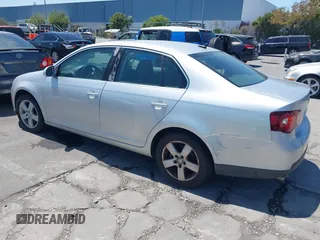 2009 Volkswagen Jetta SE with VIN 3VWRZ71KX9M039028, listed as a IAAI auction lot 42571072 with 112,389 mi miles and . Bid and sale history available at DreamBid. Image 3.