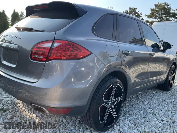 2011 Porsche Cayenne S with VIN WP1AB2A22BLA47332, listed as a Copart auction lot 65087385 with 112,033 mi miles and Salvage title. Bid and sale history available at DreamBid. Image 4.