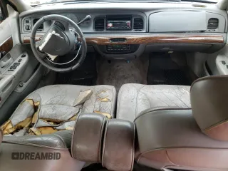 1999 Mercury Grand Marquis LS z VIN 2MEFM75W3XX617388, wystawiony jako Copart lot #58811195 z przebiegiem 162 600 mil mil oraz Szkoda całkowita • Salvage title. Historia ofert i sprzedaży dostępna na DreamBid. Obrazek 8.