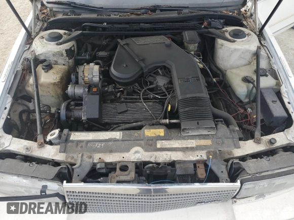 1987 Cadillac Seville z VIN 1G6KS518XHU812739, wystawiony jako Copart lot #79308574 z przebiegiem Nie podano mil oraz Szkoda całkowita • Salvage title. Historia ofert i sprzedaży dostępna na DreamBid. Obrazek 11.