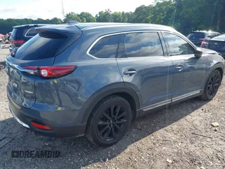 2021 Mazda CX-9 Grand Touring with VIN JM3TCADY7M0528223, listed as a IAAI auction lot 42395861 with 57,767 mi miles and . Bid and sale history available at DreamBid. Image 4.