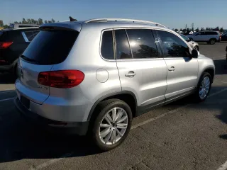 2013 Volkswagen Tiguan S with VIN WVGAV7AX8DW501081, listed as a Copart auction lot 88065365 with 157,312 mi miles and Salvage title. Bid and sale history available at DreamBid. Image 3.