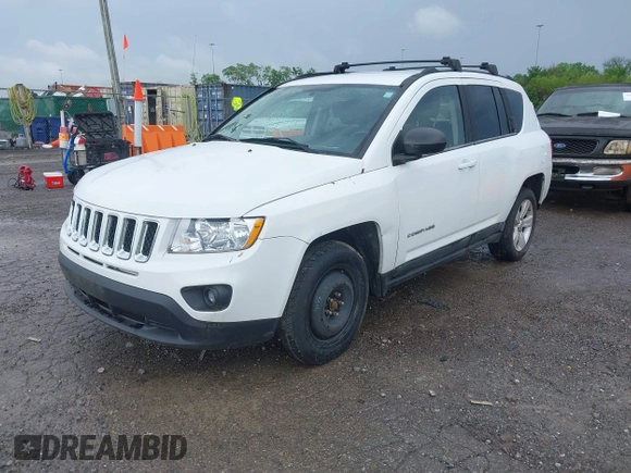 2011 Jeep Compass Latitude with VIN 1J4NT1FB1BD192076, listed as a IAAI auction lot 42121930 with 148,548 mi miles. Bid and sale history available at carsss.com. Image 2.