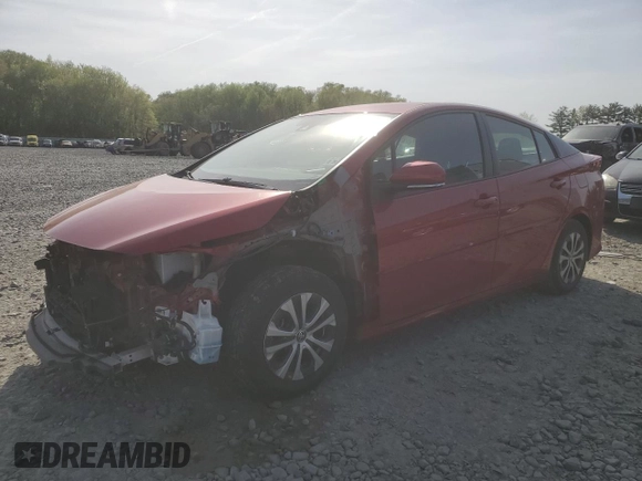 2021 Toyota Prius LE z VIN JTDKAMFP2M3182323, wystawiony jako Copart lot #54396715 z przebiegiem 68 525 mil mil oraz Szkoda całkowita • Salvage title. Historia ofert i sprzedaży dostępna na DreamBid. Obrazek 1.