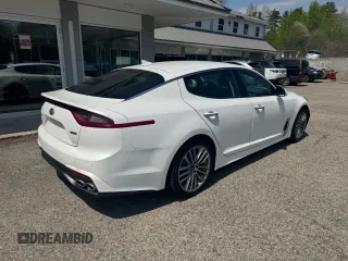 2018 Kia Stinger with VIN KNAE15LA7J6031245, listed as a Copart auction lot 55879285 with 144,020 mi miles and Clean Title. Bid and sale history available at carsss.com. Image 4.