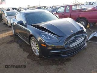 2018 Porsche Panamera 4 E-Hybrid with VIN WP0AE2A73JL127094, listed as a IAAI auction lot 41215363 with 64,461 mi miles and . Bid and sale history available at DreamBid. Image 1.