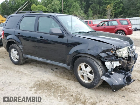 2012 Ford Escape XLS with VIN 1FMCU9C71CKA30319, listed as a Copart auction lot 60189745 with 214,736 mi miles and Salvage title. Bid and sale history available at DreamBid. Image 4.