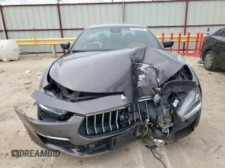 2018 Maserati Ghibli S Q4 GranLusso z VIN ZAM57YTL8J1265648, wystawiony jako Copart lot #56295795 z przebiegiem 51 857 mil mil oraz Szkoda całkowita • Salvage title. Historia ofert i sprzedaży dostępna na DreamBid. Obrazek 5.