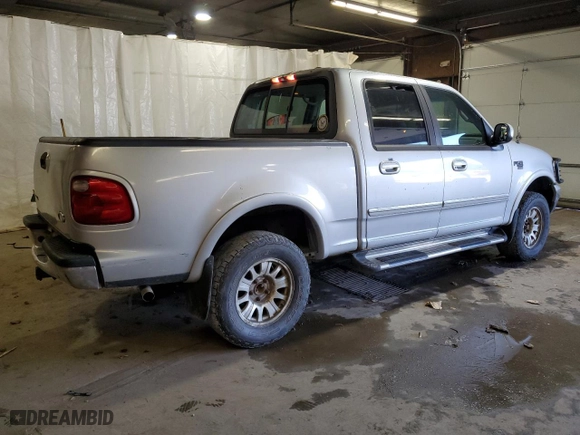 2001 Ford F-150 SuperCrew XLT with VIN 1FTRW08L41KD94810, listed as a Copart auction lot 72144184 with 191,313 mi miles and Salvage Title. Bid and sale history available at carsss.com. Image 3.