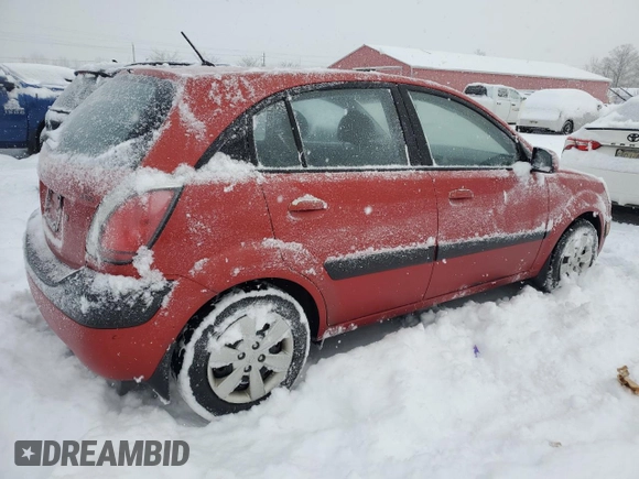 2009 Kia Rio LX with VIN KNADE243596480661, listed as a Copart auction lot 87673065 with 128,733 mi miles and Clean Title. Bid and sale history available at carsss.com. Image 3.
