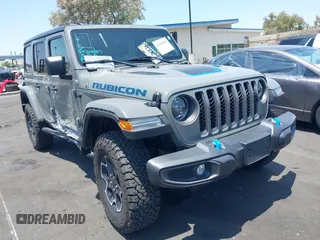 2023 Jeep Wrangler Rubicon with VIN 1C4JJXR64PW700323, listed as a IAAI auction lot 42407681 with 21,034 mi miles and . Bid and sale history available at DreamBid. Image 1.