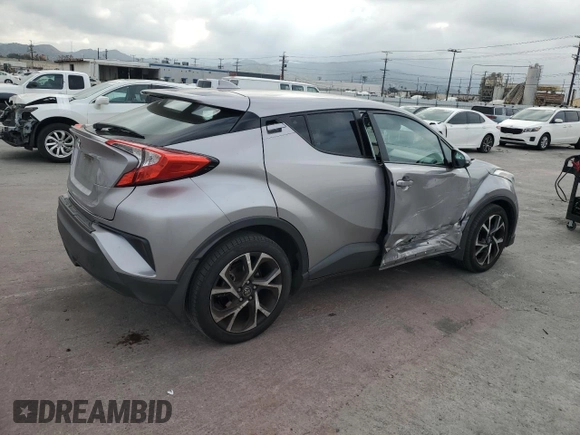 2018 Toyota C-HR XLE z VIN NMTKHMBX3JR023403, wystawiony jako Copart lot #54574245 z przebiegiem 119 657 mil mil oraz Szkoda całkowita • Salvage title. Historia ofert i sprzedaży dostępna na DreamBid. Obrazek 3.