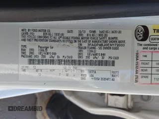 2014 Ford Fiesta SE with VIN 3FADP4BJ0EM172033, listed as a IAAI auction lot 42153874 with 155,640 mi miles. Bid and sale history available at carsss.com. Image 9.