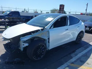 2023 Tesla Model Y Long Range with VIN 7SAYGDEEXPA129790, listed as a IAAI auction lot 41735721 with 20,402 mi miles and . Bid and sale history available at DreamBid. Image 21.