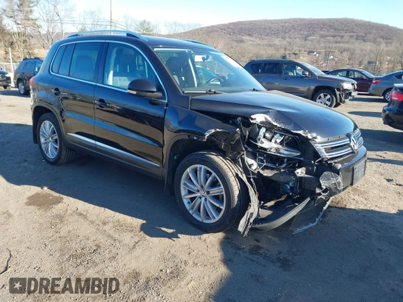 2014 Volkswagen Tiguan S z VIN WVGBV3AX4EW581302, wystawiony jako IAAI lot #41033175 z przebiegiem 69 791 mil mil oraz . Historia ofert i sprzedaży dostępna na DreamBid. Obrazek 1.