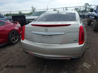 2014 Cadillac XTS Platinum z VIN 2G61T5S31E9209179, wystawiony jako IAAI lot #42241440 z przebiegiem 79 651 mil mil oraz . Historia ofert i sprzedaży dostępna na DreamBid. Obrazek 16.