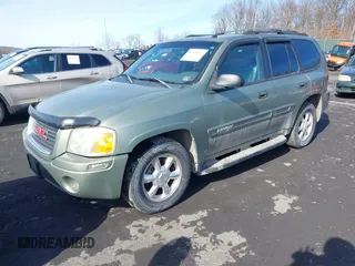 2004 GMC Envoy SLE with VIN 1GKDT13S942254932, listed as a IAAI auction lot 41509407 with 213,068 mi miles. Bid and sale history available at carsss.com. Image 2.