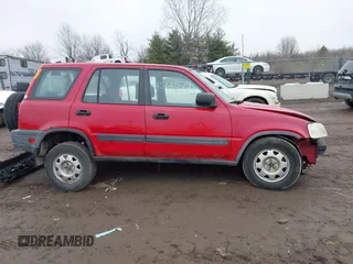 1999 Honda CR-V LX with VIN JHLRD184XXC084140, listed as a IAAI auction lot 41566574 with 206,522 mi miles. Bid and sale history available at carsss.com. Image 13.