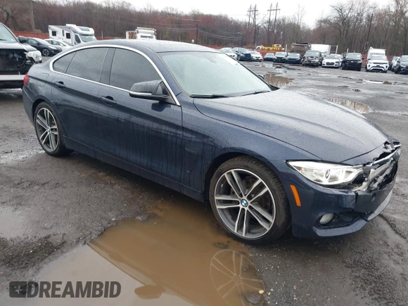 2016 BMW 4 Series 428i xDrive with VIN WBA4C9C59GG137067, listed as a IAAI auction lot 41913733 with 104,378 mi miles and . Bid and sale history available at carsss.com. Image 1.