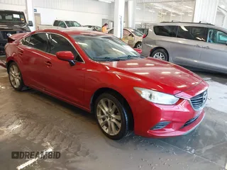 2014 Mazda 6 i Touring with VIN JM1GJ1T69E1160798, listed as a IAAI auction lot 41794080 with 159,630 mi miles and . Bid and sale history available at DreamBid. Image 1.