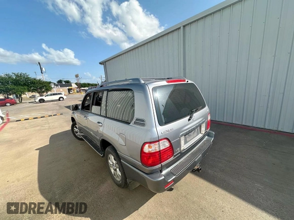 2003 Lexus LX 470 z VIN JTJHT00W933535214, wystawiony jako Copart lot #62037495 z przebiegiem 373 210 mil mil oraz Czysty tytuł • Clean title. Historia ofert i sprzedaży dostępna na DreamBid. Obrazek 3.