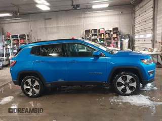 2020 Jeep Compass Latitude with VIN 3C4NJDBBXLT104849, listed as a IAAI auction lot 41606035 with 116,706 mi miles. Bid and sale history available at carsss.com. Image 13.