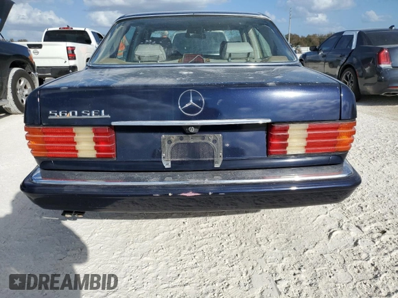 1986 Mercedes-Benz 560 with VIN WDBCA39D0GA268955, listed as a Copart auction lot 77190964 with 99,702 mi miles and Non Repairable. Bid and sale history available at DreamBid. Image 6.