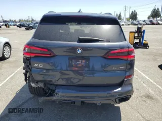 2021 BMW X5 xDrive40i with VIN 5UXCR6C06M9H65380, listed as a Copart auction lot 57445405 with 33,916 mi miles and Salvage title. Bid and sale history available at DreamBid. Image 6.