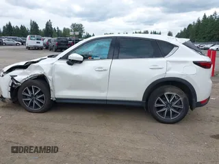 2018 Mazda CX-5 Grand Touring with VIN JM3KFBDM1J0382306, listed as a IAAI auction lot 42554947 with 121,303 mi miles and . Bid and sale history available at DreamBid. Image 14.