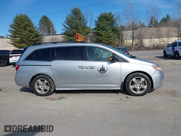 2012 Honda Odyssey Touring with VIN 5FNRL5H95CB063003, listed as a IAAI auction lot 41871975 with 179,332 mi miles and . Bid and sale history available at DreamBid. Image 13.