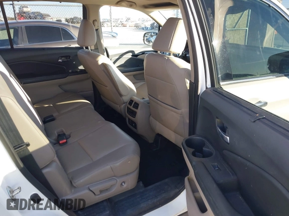 2017 Honda Pilot Touring with VIN 5FNYF6H93HB056387, listed as a IAAI auction lot 41095336 with 90,376 mi miles and . Bid and sale history available at DreamBid. Image 8.