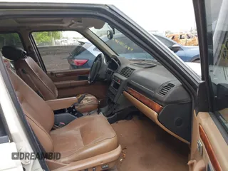 1995 Land Rover Range Rover z VIN SALPV1245SA307854, wystawiony jako IAAI lot #42380784 z przebiegiem 197 000 mil mil oraz . Historia ofert i sprzedaży dostępna na DreamBid. Obrazek 5.