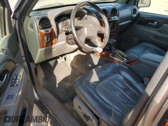2003 GMC Envoy SLE with VIN 1GKDS13S332390989, listed as a Copart auction lot 74729104 with 127,680 mi miles and Salvage Title. Bid and sale history available at DreamBid. Image 8.