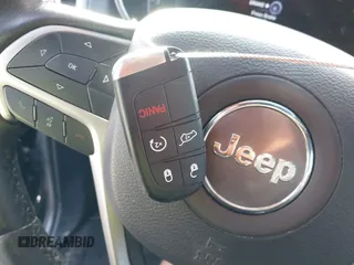 2019 Jeep Grand Cherokee Laredo E with VIN 1C4RJFAG4KC608897, listed as a IAAI auction lot 41771603 with 106,525 mi miles and . Bid and sale history available at DreamBid. Image 11.
