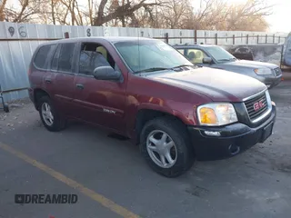2005 GMC Envoy SLT with VIN 1GKDT13S452115924, listed as a IAAI auction lot 41443704 with 215,402 mi miles. Bid and sale history available at carsss.com. Image 1.
