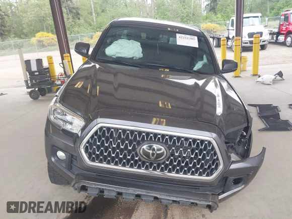 2019 Toyota Tacoma SR z VIN 3TMCZ5AN1KM257081, wystawiony jako IAAI lot #42211385 z przebiegiem 60 229 mil mil oraz . Historia ofert i sprzedaży dostępna na DreamBid. Obrazek 13.