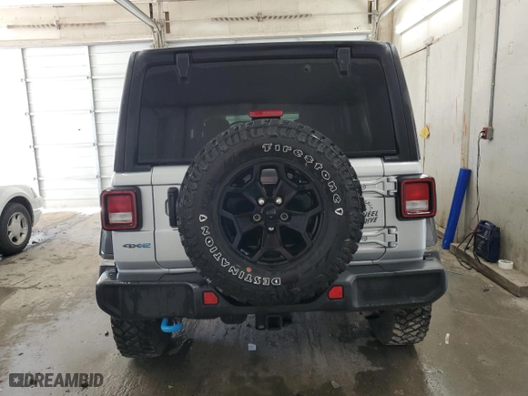 2023 Jeep Wrangler 4xe with VIN 1C4JJXN64PW630179, listed as a Copart auction lot 44457744 with 27,905 mi miles and Clean Title. Bid and sale history available at carsss.com. Image 6.