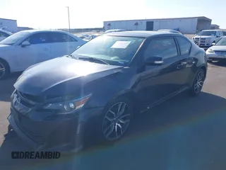 2015 Scion tC with VIN JTKJF5C71F3090963, listed as a IAAI auction lot 41802183 with 107,650 mi miles. Bid and sale history available at carsss.com. Image 2.