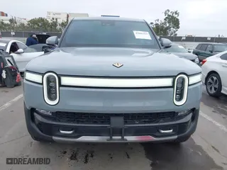 2023 Rivian R1T Launch Edition with VIN 7FCTGAAL3PN017339, listed as a IAAI auction lot 42041423 with 15,098 mi miles. Bid and sale history available at carsss.com. Image 13.